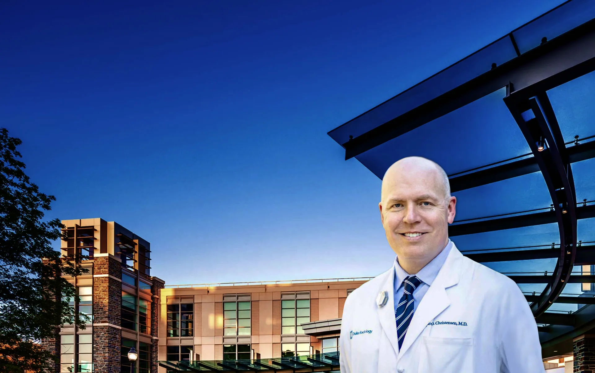 Dr. Jared Christensen standing in front of Duke University Medical Center