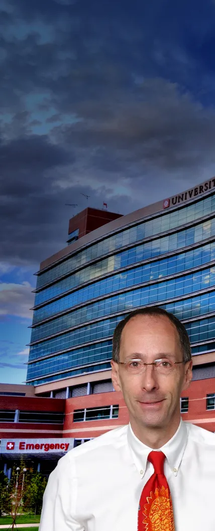 Dr. Peter Sachs standing in front of University of Colorado Hospital