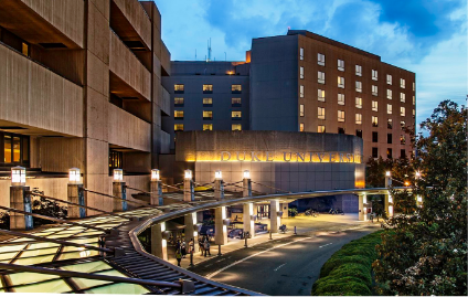 Healthcare facility exterior at dusk representing clinical environments deploying Riverain Technologies ClearRead solutions, used as case studies section imagery.