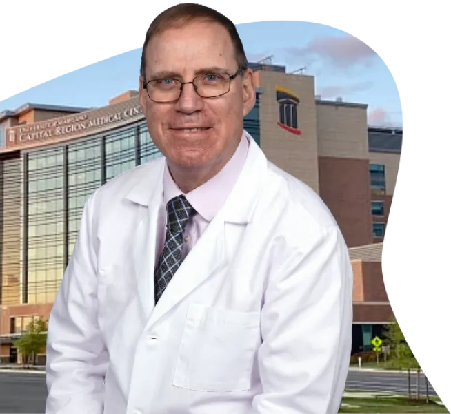 Clinical expert photographed outside a healthcare facility, representing the medical professionals who rely on Riverain Technologies ClearRead solutions.