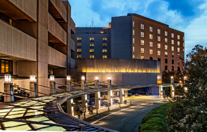 Healthcare facility exterior photographed at twilight, representing the hospital environments where Riverain Technologies ClearRead CT and Xray solutions are deployed.