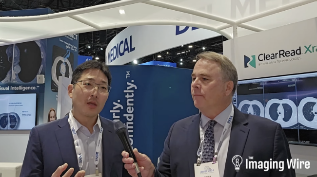Imaging Wire video interview with Jonathan Chung M.D. at RSNA 2024 featuring ClearRead Xray booth display and AI radiology discussion.
