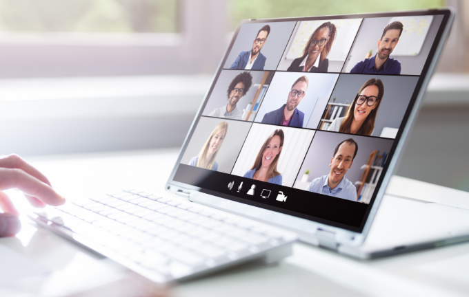 Open laptop showing a multi-participant video conference call, representing Riverain Technologies' webinar program for radiology education and AI imaging training.